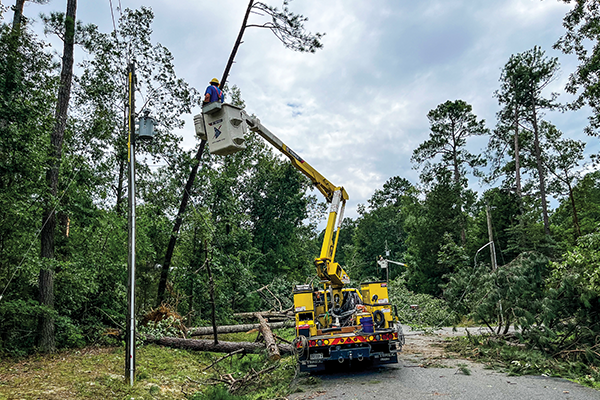 Storm Damage REC Bucket Truck and fixing pole