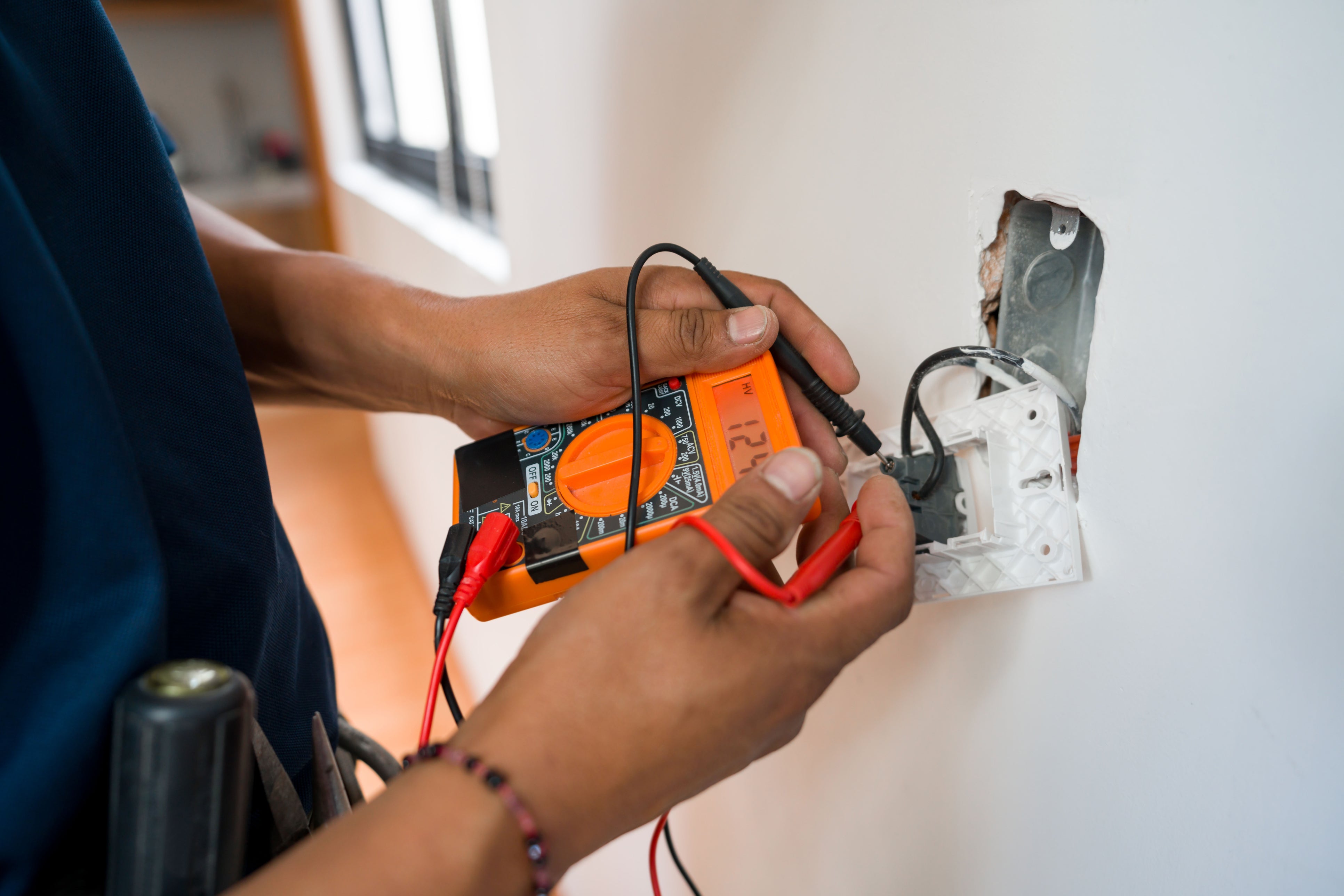 Electrician performing an electrical inspection