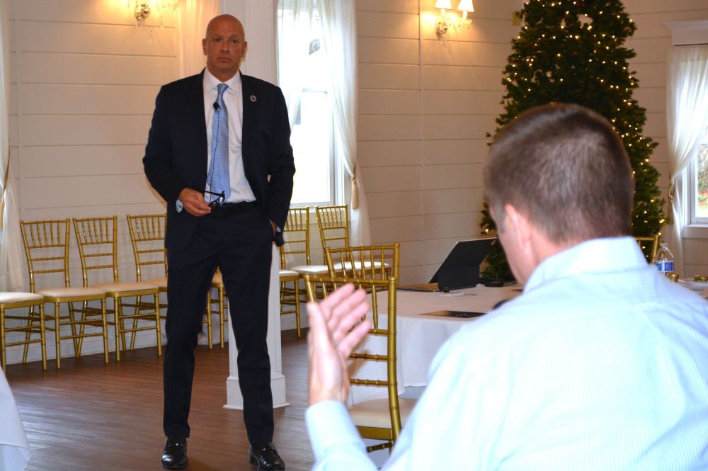 John Hewa speaks to local leaders in Berryville