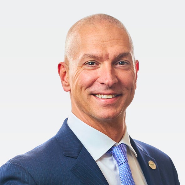 Photo of John Hewa, President & CEO of REC