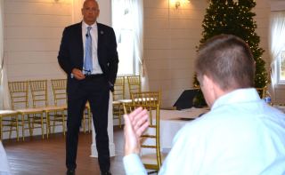 John Hewa speaks to local leaders in Berryville