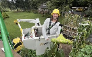  Little Lift: REC Crew Helps Local Grower Harvest Record-Setting Plants